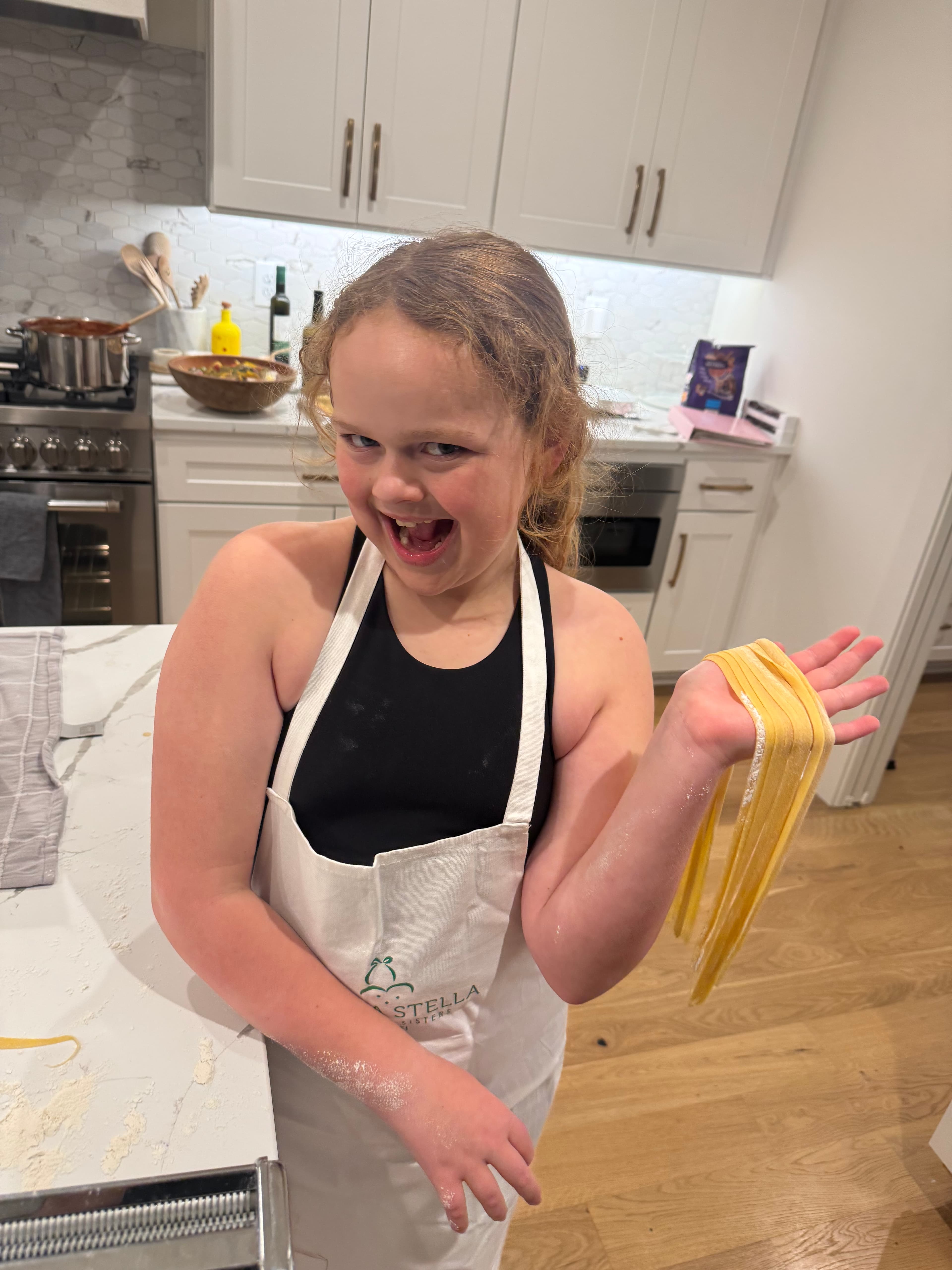 Neighbors making pasta at Lou's LIFE cooking experience in Peachtree City