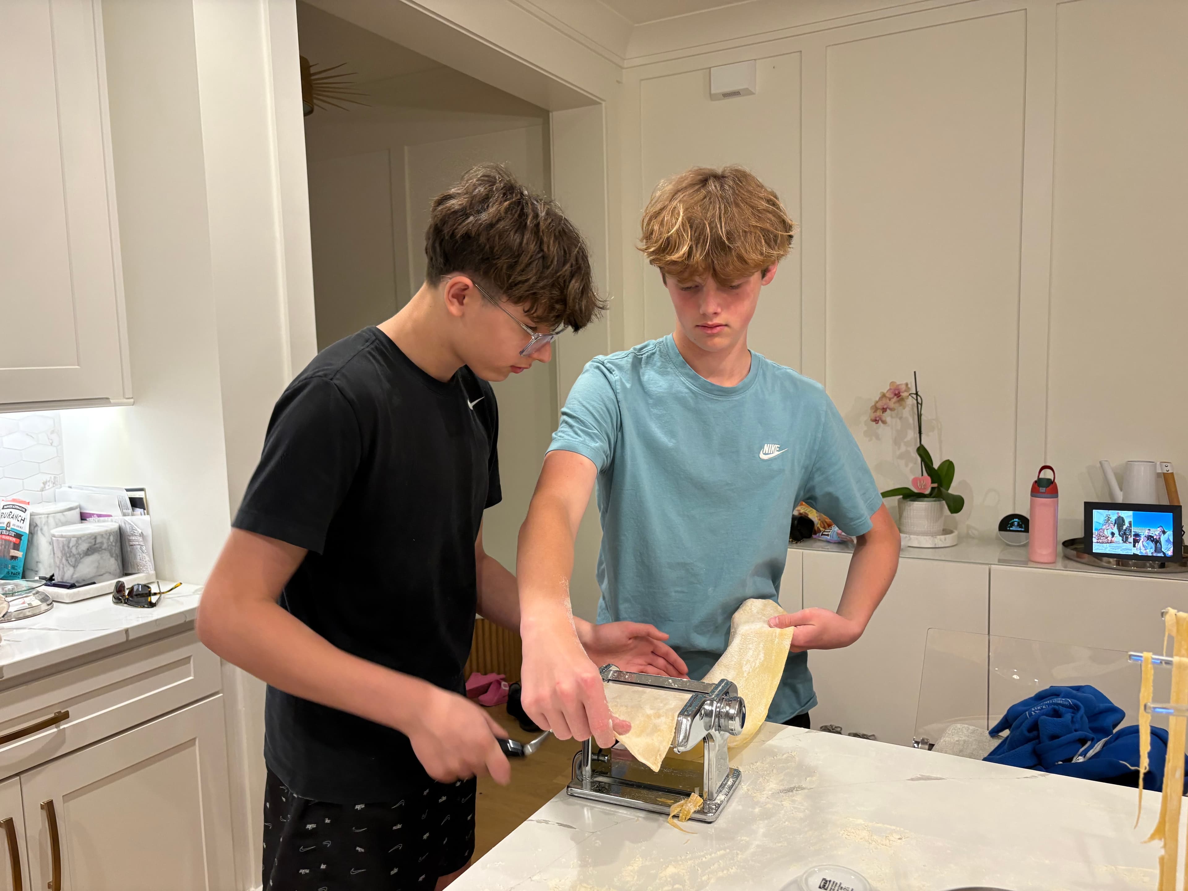 Neighbors sitting down to eat together at Lou's table