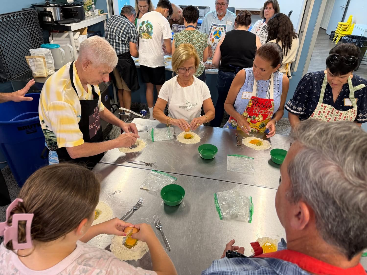 Community members making pasta by hand at the Buoni Amici Lodge 3021 LIFE class
